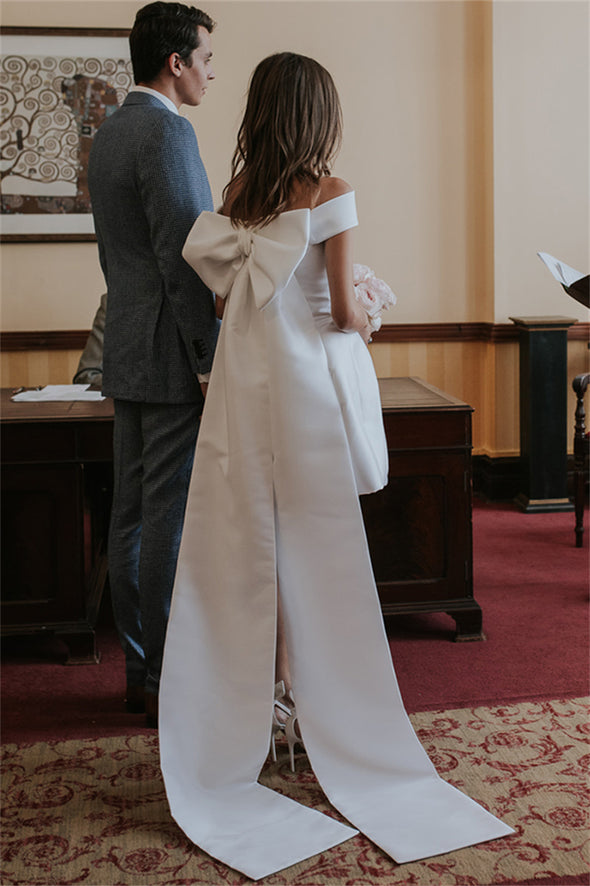 Minimalist Photography Bridal Gowns With Large Bow Train